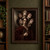 Pale-faced figure in burgundy robes holding a closed book, surrounded by overlapping faces against a shadowed background.; frame shown for styling only