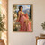 Seated woman in a rose-pink gown with flowers in her hair beside a white dove above a coastal garden.; frame shown for styling only