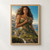 Leaf-adorned woman holding a sprig as her lower figure merges into a sunlit landscape of mountains, rivers, and waterfalls.; frame shown for styling only