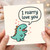 Cute Dinosaur Pun Love Card - I Roarry Love You - Funny Anniversary or Valentine's Day Card for Boyfriend, Girlfriend, Husband or Wife - Adorable Dino Hearts Design