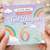 God Daughter 6th Birthday Card, Magical Rainbow Clouds Birthday Card