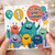 Great Granddaughter 1st Birthday Card, Cute Monster Balloon and Gifts Design