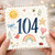 104th Birthday Card, Cute Watercolour Sun, Rainbow and Garden Design