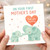 First Mother's Day Card from Baby - Cute Elephant Mum and Calf with Heart Balloon - 'On Your First Mother's Day - Love You Mummy' - New Mum Card