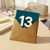 13th Birthday Card - Age 13 - Bold Minimal Number on Teal with Long Shadow - Modern Teenager Birthday for Boy or Girl