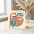 Funny Birthday Card - Cartoon Skeleton with Thumbs Up, speech bubbles say 'Happy Birthday!' and 'Cheers.' Playful bones humour for friends, family or colleagues