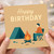 Happy Birthday Camping Card - Tent, Campfire and Camper Illustration - Outdoor Adventure Birthday Card for Campers, Hikers and Nature Lovers