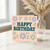 Happy Birthday Card - Bold Teal Typography with Pastel Flowers and Hearts - Retro Floral Design for Friends, Family or Colleagues