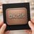 OK Sis Funny Sister Birthday Card - Minimal Plaque-Style Design in Bronze Tones - Cheeky Modern Greeting for Her