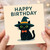 Happy Birthday Card - Cute Black Cat in Witch Hat with Orange Bow Tie - Playful Cat Lover Design, Halloween-Inspired