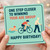 Funny Birthday Card - One Step Closer to Winning Your Age Group - Triathlon Humour with Swimmer, Cyclist & Walking Stick Gag - For Friends, Family, Him or Her