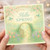 Hello Spring Greeting Card - Pastel Garden Gate, Blossom and Birds - Elegant Seasonal Floral Card for Springtime Wishes