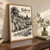 Bibury, England travel poster full-bleed print styled in Original angled oak-console; frame and props not included
