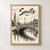 Seville, Spain travel poster full-bleed print styled in Front oak frame - corrected opening; frame and props not included