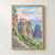 Meteora, Greece travel poster full-bleed print styled in Front oak frame - corrected opening; frame and props not included