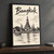Bangkok, Thailand travel poster full-bleed print styled in Black frame / charcoal wall; frame and props not included