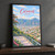 Caracas city view full-bleed print styled in Black frame / charcoal wall; frame and props not included