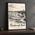 Flamborough Head chalk cliffs full-bleed print styled in Black frame / charcoal wall; frame and props not included