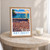Key West Southernmost Point bordered print styled in Oak frame / bedside table; frame and props not included