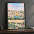Jerusalem city view full-bleed print styled in Black frame / charcoal wall; frame and props not included