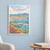 Cartagena city view full-bleed print styled in White frame / blue sitting room; frame and props not included