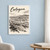 Cartagena city view full-bleed print styled in White frame / blue sitting room; frame and props not included