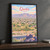 Quetta city view full-bleed print styled in Black frame / charcoal wall; frame and props not included