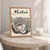 Makkah city view full-bleed print styled in Oak frame / bedside table; frame and props not included