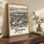 Dnipro city view full-bleed print styled in Original angled oak-console; frame and props not included