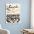 Kampala city view full-bleed print styled in White frame / blue sitting room; frame and props not included