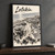 Latakia city view full-bleed print styled in Black frame / charcoal wall; frame and props not included