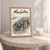 Manhattan city view full-bleed print styled in Oak frame / bedside table; frame and props not included
