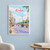 Korba city view full-bleed print styled in White frame / blue sitting room; frame and props not included