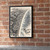 Barra da Tijuca city view full-bleed print styled in Black frame / exposed brick; frame and props not included