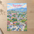 Tegucigalpa city view full-bleed print styled in Unframed sheet - corrected A-series; frame and props not included