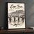 Cape Town city view full-bleed print styled in Black frame / charcoal wall; frame and props not included