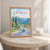 San Pedro Sula city view full-bleed print styled in Oak frame / bedside table; frame and props not included