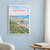 Kota Kinabalu city view full-bleed print styled in White frame / blue sitting room; frame and props not included