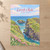 Carrick-a-Rede rope bridge full-bleed print styled in Unframed sheet - corrected A-series; frame and props not included