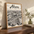 Akure city view full-bleed print styled in Original angled oak-console; frame and props not included