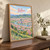 Bilbao city view full-bleed print styled in Original angled oak-console; frame and props not included