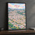 Mbeya city view full-bleed print styled in Black frame / charcoal wall; frame and props not included