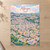 Mbeya city view full-bleed print styled in Unframed sheet - corrected A-series; frame and props not included