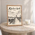Khartoum North city view full-bleed print styled in Oak frame / bedside table; frame and props not included