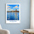 Aswān city view bordered print styled in White frame / blue sitting room; frame and props not included