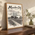 Manukau City city view full-bleed print styled in Original angled oak-console; frame and props not included