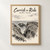 Carrick-a-Rede rope bridge full-bleed print styled in Front oak frame - corrected opening; frame and props not included