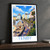 Tenby harbour pastel houses bordered print styled in Black frame / charcoal wall; frame and props not included