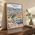 Quito city view full-bleed print styled in Original angled oak-console; frame and props not included
