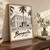 Benguela city view full-bleed print styled in Original angled oak-console; frame and props not included
